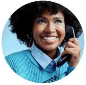 Person smiling while talking on telephone